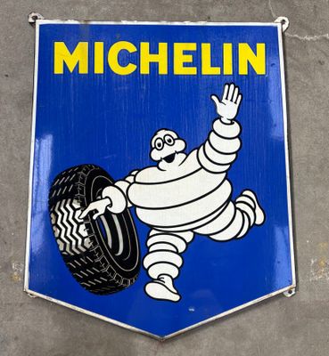 a michel michel sign hanging on the side of a building