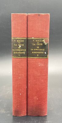 two red books sitting on top of a table next to each other