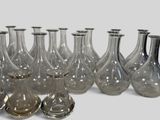 a lot of glass vases that are sitting on a table