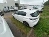 a white car parked in a parking lot next to other cars