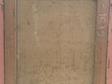 an old picture of a wooden frame with a clock on it