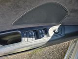 a close up of a car ' s interior with the door panel open