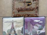 three different types of pillows on a tiled floor with a picture of a boat and a tower