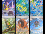 four different pokemon cards are shown in a row on a black background