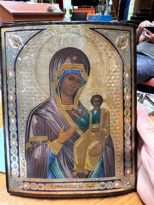 painting of a woman holding a child in her arms