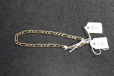 two tags attached to a chain on a black surface