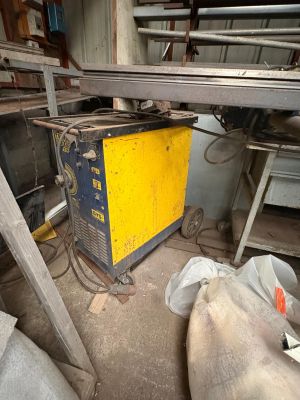 a yellow machine that is sitting in the middle of a room