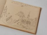 someone is drawing a picture of a small town in a book