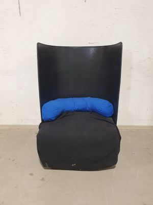 an image of a black chair with a blue pillow on top of it