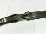 a knife that is sitting on top of a piece of glass