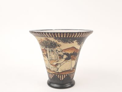 a vase with a picture of a man and a woman on it