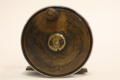 a metal object that is sitting on a white surface