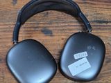 an image of a pair of headphones sitting on top of a wooden table