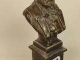 bronze bust of a man with a beard and a number on it