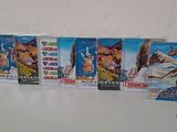 five dvds that are sitting on a table