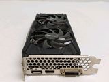 a close up of a video card sitting on a white surface