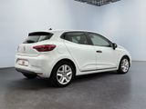 the rear end of a white car in a white room