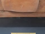 a statue of a man with a hat on top of a table