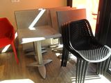 two chairs and a table in the corner of a room
