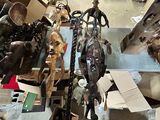 many different types of animal heads on display in a room