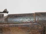 a close up of a rifle with a wooden handle