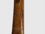 a close up of a musical instrument with a wooden body