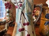 three vases sitting on a table next to each other