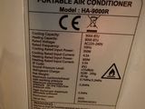a picture of a portable air conditioner label on the side of a refrigerator