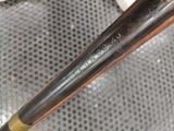 a close up of a baseball bat on a chair