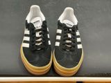 adidas superstar shoes on display in a shoe store