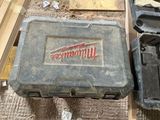 a tool box that is sitting on the floor next to other tools