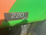 a close up of a green and orange tractor