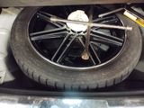 a close up of a tire on the back of a car
