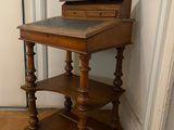 a small wooden table with a drawer on top of it