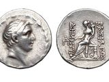 a close up of a coin with an image of a woman on it