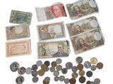 many different types of money and coins on the table