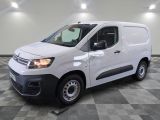 the white van is parked on a checkered tile floor