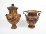 two vases sitting next to each other on a white surface