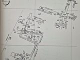 an open book with a drawing of a plan and a drawing of a building