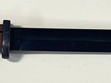 an image of a knife on a white surface