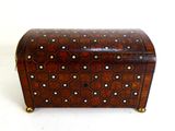 a small wooden box with a decorative design on it