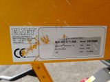 a close up of a label on a yellow machine