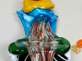 a glass object that is sitting on a plate