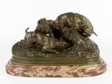 bronze sculpture of a group of dogs attacking a lion on a marble base