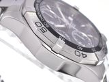 a close up of a watch on a metal bracelet
