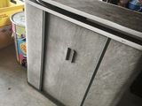 a kitchen with a counter and a refrigerator in it