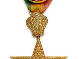l'image d'une médaille surmontée d'une étoile