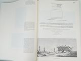 an open book with a picture of a building on it