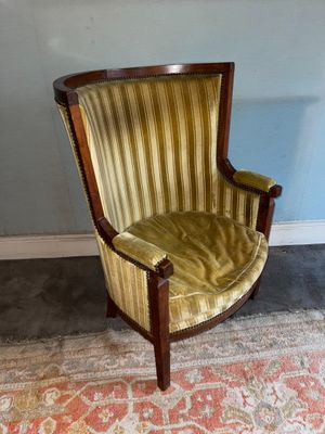 an image of a chair in a room with a rug on the floor