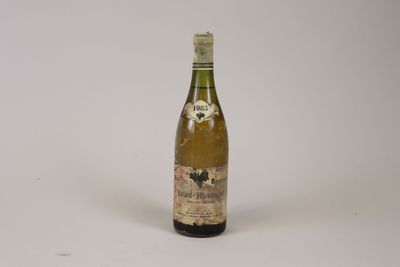 a bottle of wine that is sitting on a table